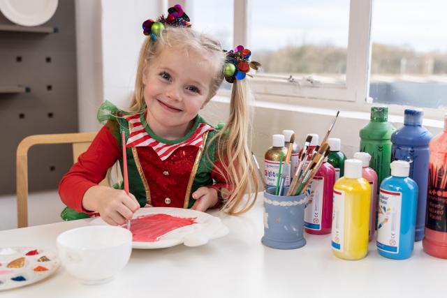 Little girl painting in Decorating Studio