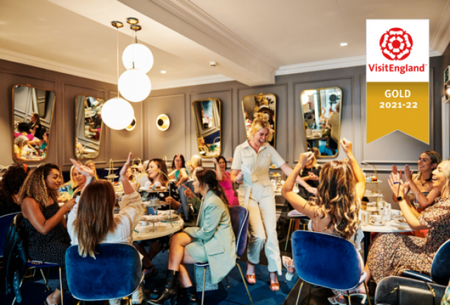 People celebrating in Tea Room