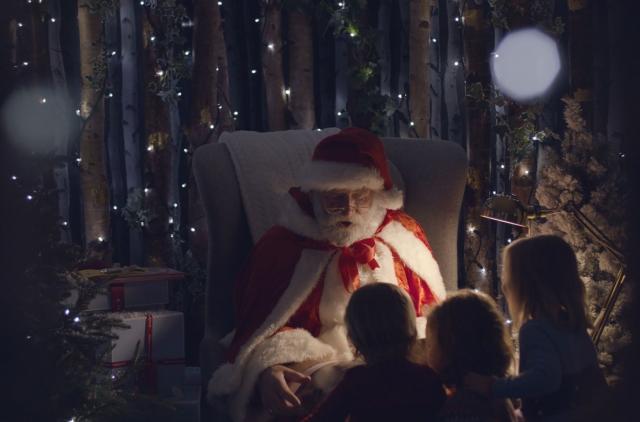 Santa in his grotto with children