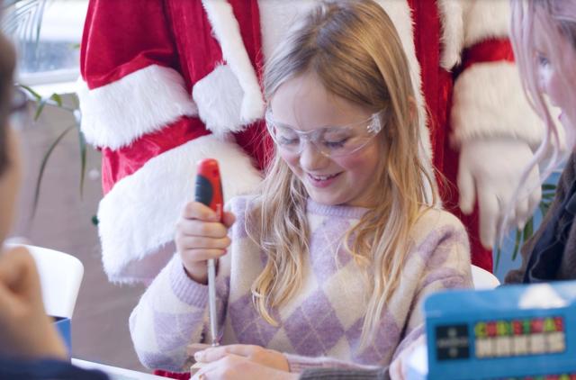 Young girl in santas workshop