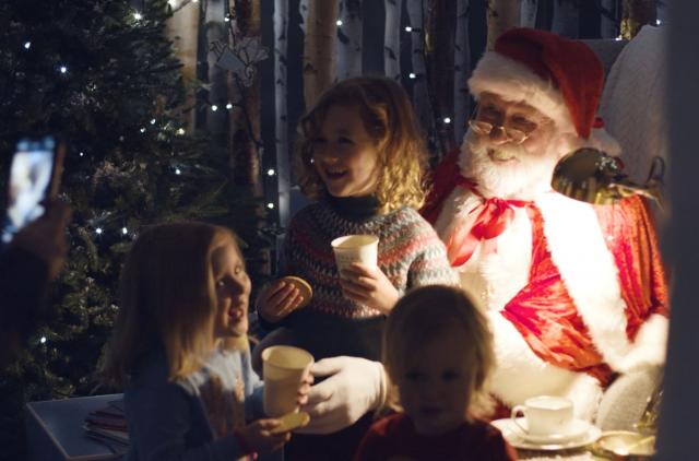 Santa with children in his grotto