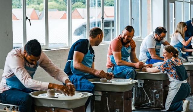 Group on potters wheel