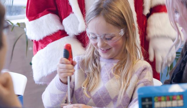 Young girl in santas workshop