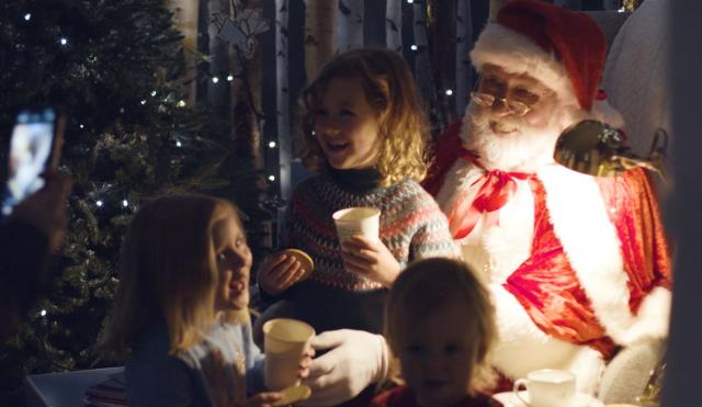 Santa with children in his grotto