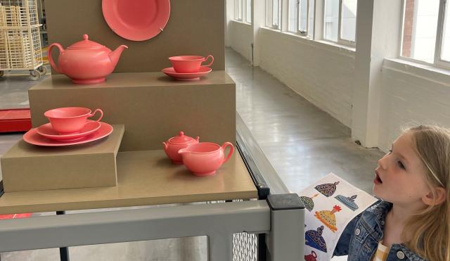 Child looking at tea seat in factory