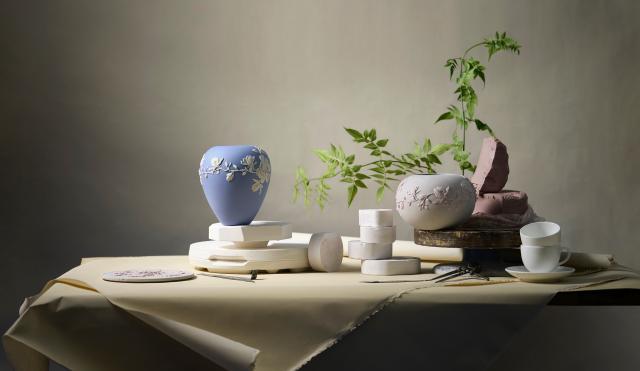 still life of wedgwood blue vase and clay 