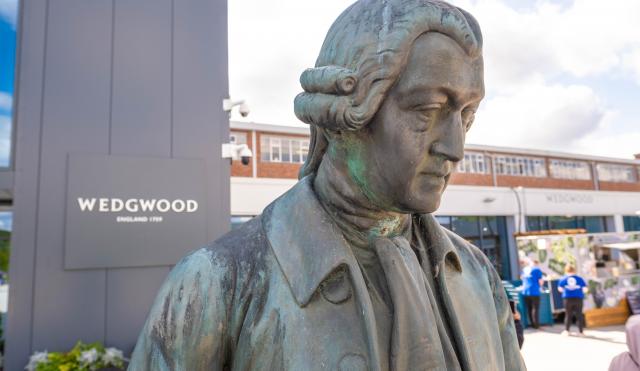Statue of josiah wedgwood with Wedgwood sign in the background