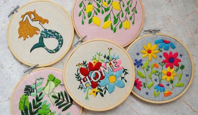 image of embroidery examples, five circle frames with varying patterns