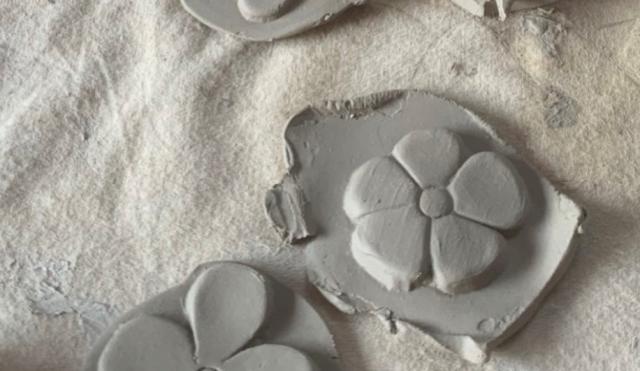 Image of clay tiles with chunky flowers embossed