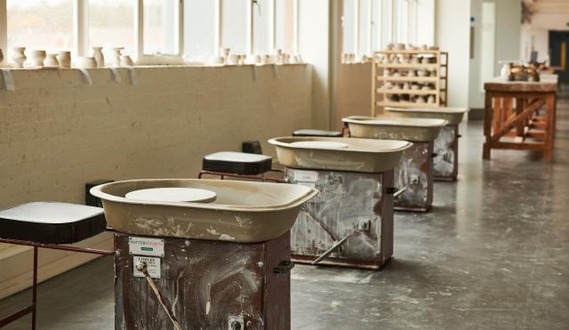 Image of Potter's Wheels all line up in the Clay Studio 