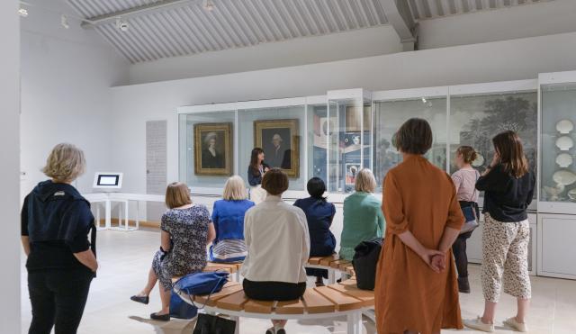 Image of tour taking place in the galleries of V&A